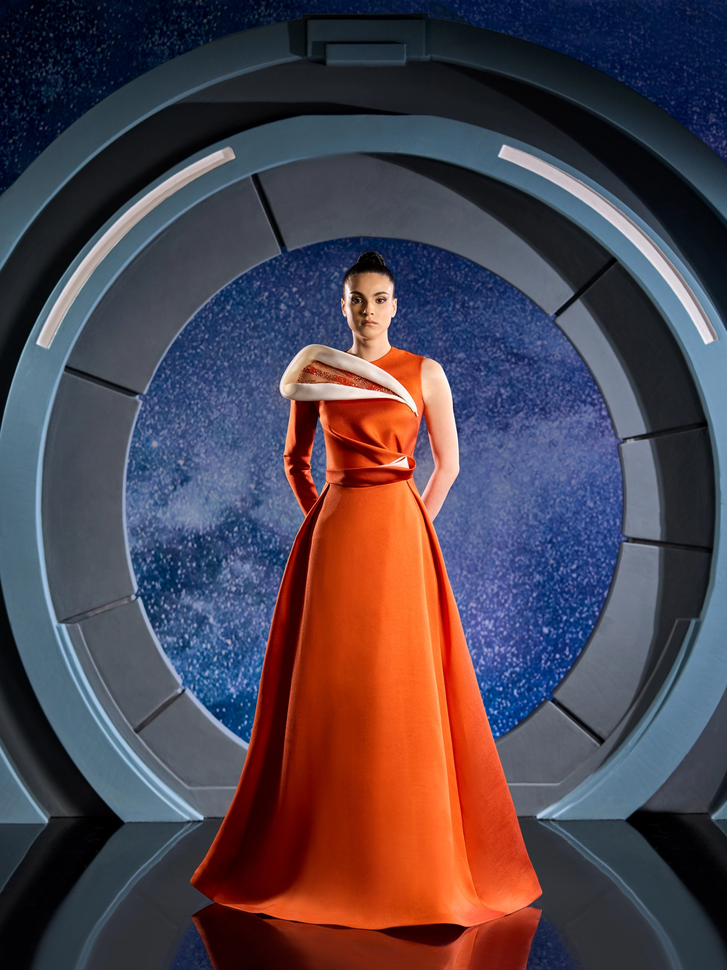 FW 132 -Brick piquet dress, featuring one long sleeve elegantly  draped with an asymmetrical cut at the shoulder. Orange US 01